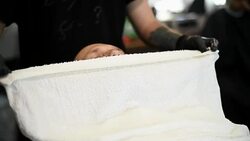 Close-up of beautiful attractive adult man with beard in a barber shop Stock Footage