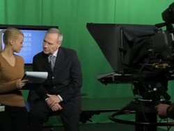 Female producer and television presenter discussing Stock Footage