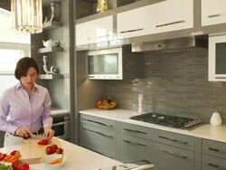 Young woman in the kitchen Stock Footage