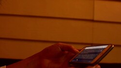 young woman using smart phone on the bed Stock Footage