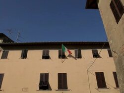 WS LA LD Italian Flag on Building / Tuscany, Italy Stock Footage