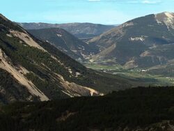 AERIAL over mountains to valley with village/ Alpes-Maritimes, France Stock Footage