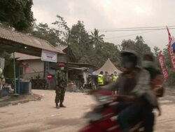 Police guide traffic in ash fallout zone near Merapi volcano, Indonesia 28 October 2010 / AUDIO Stock Footage