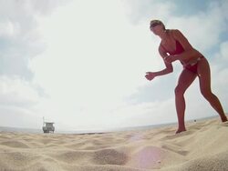 MS TS SLO MO Woman diving for beach volleyball / Redondo Beach, California, United States Stock Footage