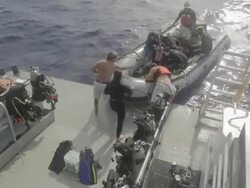 MS Shot of Scuba diving group getting down back to dive boat  / Socorro Islands, Mexico Stock Footage