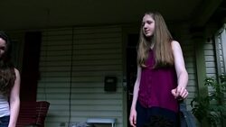 MS TD Married lesbian couple with family on front porch of home on summer evening Stock Footage