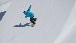 Snowboarder performs a trick Stock Footage