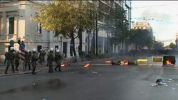 Youths and police scuffle on teen's death anniversary News Clip