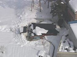 WS AERIAL ZI View of People removing snow on roof / Gangneung, Gangwon do, South Korea Stock Footage