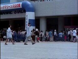 People crowding by ticket counter, pan right, Chiba Marine baseball stadium, Tokyo, Japan Stock Footage