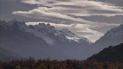 Haze partially obscures distant mountain peaks. Stock Footage