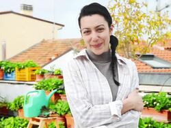 Successful young female gardener on his roof garden Stock Footage