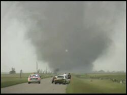 WA zoom in to MWA, Storm chasers watching tornado, USA Stock Footage