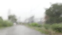 Driving the Car on the Country Road During Rainy Season Stock Footage