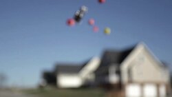 Slow Motion of Tossing Dice In Front Of Homes Stock Footage