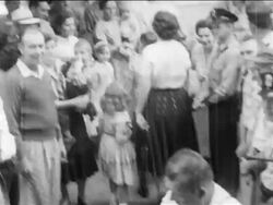 B/W 1950s REAR VIEW pro-segregation parents leading children away from segregated school / newsreel Stock Footage