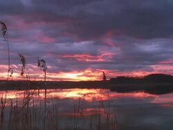 HD Motion Time-Lapse: Dramatic Clouds Over Lake Stock Footage