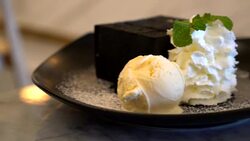 Charcoal toast with ice-cream and whip cream Stock Footage