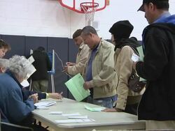 November 2, 2010 MS Arab voters receiving ballots / Dearborn, Michigan, United States Stock Footage