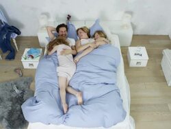 happy family chilling in bed Stock Footage