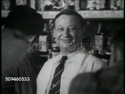 1938: ACCIDENT PREVENTION: NIGHT: Policeman standing outside building. Adults playing pinball machine in bar. Bartender smiling. People in bar dancing. Patrolman waiting in dark. Male drinking alone at bar. Car moving out of club parking lot. Instructional Video