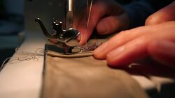 Tailor sewing on the sewing machine Stock Footage