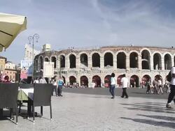 MS Cafes and Restaurants at Piazza Bra and Tourists roaming in front of Arena di Verona / Verona, Veneto, Italy Stock Footage