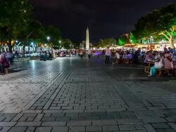 People enjoying Ramadan at the Hippodrom at night tilt Stock Footage