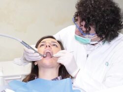 Dentist at Work with dental drill Stock Footage
