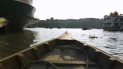 Sadarghat Launch Terminal in Dhaka Bangladesh is a bustling passenger transport hub where tiny wooden boat taxis paddle alongside huge steel ferries Stock Footage