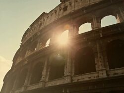 Coliseum of Rome, or Colosseo, with sun flares Stock Footage