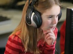 CU TD Student wearing headphones sitting in computer lab / Richmond, Virginia, United States  Stock Footage