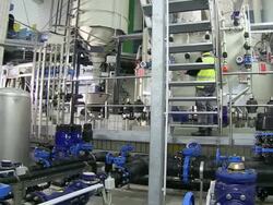 MS PAN Worker working in decalcifying plant at water works / Konz, Rhineland-Palatinate, Germany Stock Footage