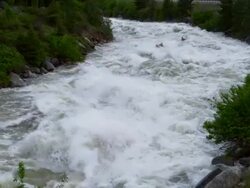 WS SLO MO Two kayakers descending western river in huge whitewater / Banks, Idaho, United States Stock Footage