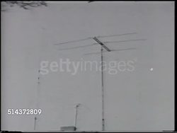 1966: TELEVISION ANTENNAS: VS Roof mounted broadcast signal analog TV reception antennas.      VHF, UHF, tall, vertical, outdoor, home, house, receiving, reception, weak-signal, omni directional, over-the-air, post-war technology.   Note: Some fleck Instructional Video