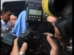 Suspected Canadian paedophile arrives at police HQ in Bangkok after his arrest News Clip