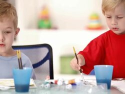 Little children painting in the classroom, camera move, HD video Stock Footage