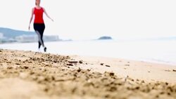 Woman exercise on the beach Stock Footage