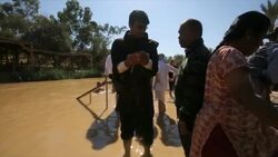 Pilgrims and Baptists at Qasr el Yahud baptism site in the Jordan River Valley, Israel Stock Footage