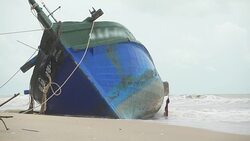 Fisherman boat aground in Thailand Stock Footage