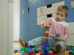 Little Boy Stacking Up Toy Blocks Stock Footage