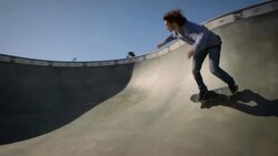 skater skating through dog bowl at venice California skatepark Stock Footage