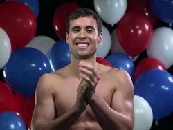 Man clapping with balloons in background Stock Footage