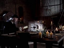 Nostradamus sits at a desk and reads. Stock Footage