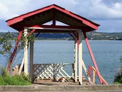 MS Shot of small open structure on edge of water / Dalcahue, Isla Grande de ChiloÃŒÂ©, Chile Stock Footage