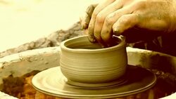man creates pottery on a potter's wheel Stock Footage