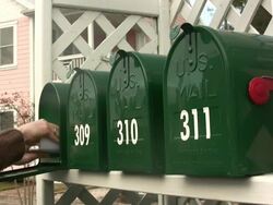 Handing reaching into a mailbox Stock Footage