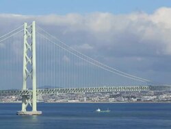 WS PAN View of Akashi Kaikyo Bridge, longest central span of any suspension bridge in world / Awaji, Awaji Island, Japan Stock Footage