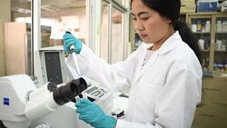 Young Asian women scientist working with pipette in laboratory Stock Footage