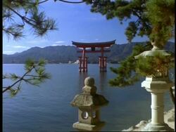 WA view across water to floating gate of the Itsukushishima shrine, Miya-Jima island, Japan Stock Footage